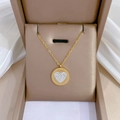 Detail of gold heart pendant with crystals in a jewelry box on white silk fabric - Titanium Steel / K425 Gold Necklace (K425)