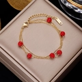 Detailed view of multilayered gold stainless steel bracelet with red paved crystal balls - Gold 3-Layer with Red Pavé Balls