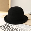 Classic black knitted wool bucket hat with rolled edge for winter warmth and fashion - Black