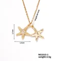 Detail of 18K gold starfishes pendant necklace with white zircon pavé and adjustable chain - Gold Double Starfish