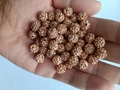 Close-up of champagne crystal clay beads with straight holes for DIY jewelry making - Peach