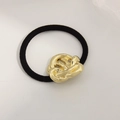 Minimalist elastic hair tie with a textured gold irregular metal knot accent - Knotted Flower Gold