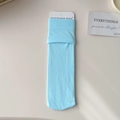 Light blue thin velvet socks in a minimalist flat lay with elegant paper card packaging - One Size / Sky Blue