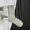 Detailed macro view of gray knitted mid-calf socks with ribbed texture on fabric - Short Light Grey