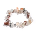 Macro shot of irregular multi-color natural quartz crystal gravel bracelet for women - Rutilated Quartz