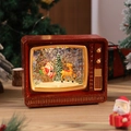 Vue détaillée du téléviseur de Noël rétro avec scène du Père Noël et paillettes brillantes - Renne et Traîneau / Rouge