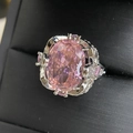 Detailed close-up of pink oval gemstone ring with 18k plating and micro-pave crystals - Pink Rhinestone