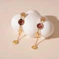 Detail of vintage geometric earrings with purple glass beads on a cloud display stand - Silver Pin Red Glass Bead Drop Earrings