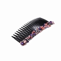 Detail of black plastic hair comb featuring purple and pink stones and white pearl beads - Purple Hair Comb