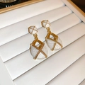 Macro shot of gold floral drop earrings with white enamel inlay in jewelry box - White Vintage Enamel Geometric Stud Earrings (14#)
