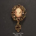 Vintage gouden cameo broche met roze profiel en sprankelende strassteentjes - 4.0x7.3cm / Koffie (XD7355)