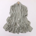 Detailed view of grey-green faux silk headscarf draped with soft folds and elegant sheen - Pine Green