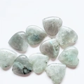 Polished heart-shaped labradorite stones in natural grey and green tones on white - Labradorite