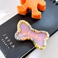 Pink bone-shaped hair clip with multi-color woven edge and Cute gold lettering - Bone-Pink
