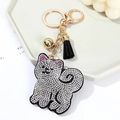 Sparkling silver rhinestone cat keychain with golden bell and black tassel detail - White