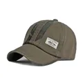 Army green and khaki cotton baseball cap featuring camo patches and vintage fabric label - Army Green