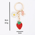 Zinc alloy strawberry keychain with daisy and heart charms in red and gold finish - Keychain Strawberry Flower
