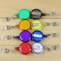 Retractable badge reel set with 8 vibrant colors and metal clip on wooden background - Retractable Badge Reel / Blue