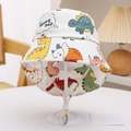 Detail of kids cartoon dinosaur sun hat featuring adjustable chin strap and Sunny Day print - Off-White Sunny Day Dinosaur