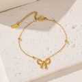Elegant 18k gold plated stainless steel necklace with a delicate bow pendant and small beads - Gold Bracelet
