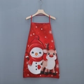 Festive red Christmas apron with cartoon snowman and reindeer print hanging on a wall - Red Snowman Elk Style