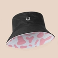 Double-sided bucket hat with black smile pattern and pink cow print lining - Double Sided Smile Cow Print / Pink Cow Print