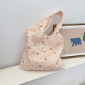 Detailed close-up of pink quilted tote bag with bear and floral pattern on fabric - Purple Bowknot Rabbit