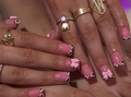 Close-up of pink press-on nails featuring French leopard print tips and 3D bow charms - French Leopard Bow Hand Style (DW59) / Yellow Jelly Glue + Nail File
