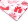 Close-up of Christmas tissue paper with red gift boxes, stockings and snowflakes patterns - Red and White Enamel Christmas Sock