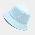 Close-up of light blue cotton bucket hat featuring white smiley face embroidery - M (56-58cm) / Light Blue