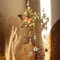Detail of star metal suncatcher with green leaves, butterfly, and crystal prism ball - 10cm Amethyst Leaf Star