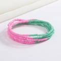 Detail view of pink and green beaded belly chain with elastic multi-layer design - Pink and Green