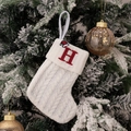 White knitted Christmas stocking with red embroidered letter H and Santa hat pattern - Embroidered Knitted Small Sock White H