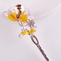 Close-up of golden floral hair pin with crystal core and enamel flower detail - Gold Yellow White Enamel Flower Champagne Crystal (FZ028)
