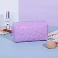 Purple Y2K style heart embossed makeup bag with a zipper made of glossy PU leather - Pillow Shape / Purple