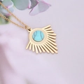 Golden sunburst pendant necklace with turquoise stone on soft pink fabric background - 2# Blue