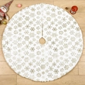 White plush Christmas tree skirt with gold snowflake patterns on wooden floor - Gold Stamped Snowflake Tree Skirt