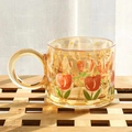 Amber glass mug with hand-painted tulip pattern in a minimalist luxury style - Amber Tulip Painted Mug