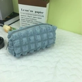 Sky blue popcorn textured pencil case with a gray zipper closure for school or makeup - Blue