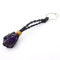 Handmade woven net keychain featuring a natural purple amethyst crystal stone pendant - Amethyst + Black Mesh Keychain