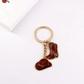 Detail view of gold-plated western keychain with brown enamel cowboy hat and boot charms - Brown Hat & Boots