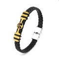Detail of black braided leather bracelet with golden tree of life and silver buckle - Tree