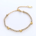 Golden stainless steel butterfly bracelet featuring sparkling rhinestones on a white background - Gold