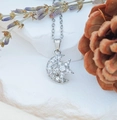Silver celestial crescent moon and star pendant necklace with sparkling cubic zirconia - Rotating Star Moon (XL2325)