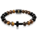 Detail of tiger eye bead bracelet featuring a black cross charm and golden letter B bead - Letter B