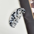 Half-moon acetate hair comb featuring black and white marble tortoiseshell pattern - B&W Oval
