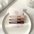Three seamless matte duckbill hair clips in brown and cream earth tones on a display card - Duckbill Clip / Set of 3