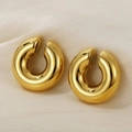 Golden chunky C-shaped hoop earrings with mirror polished finish on silk fabric - Polished Gold