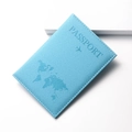 Close-up of sky blue faux leather passport cover with embossed world map and texture - Sky Blue