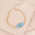 Goudkleurige vissen sterrenbeeld armband met blauwe emaille bedel en zirkoniasteentjes - Vissen